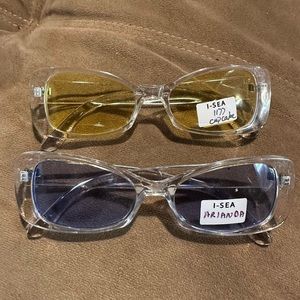 Unisex fashion/sunglasses. with purple lenses. One pair with yellow lenses new